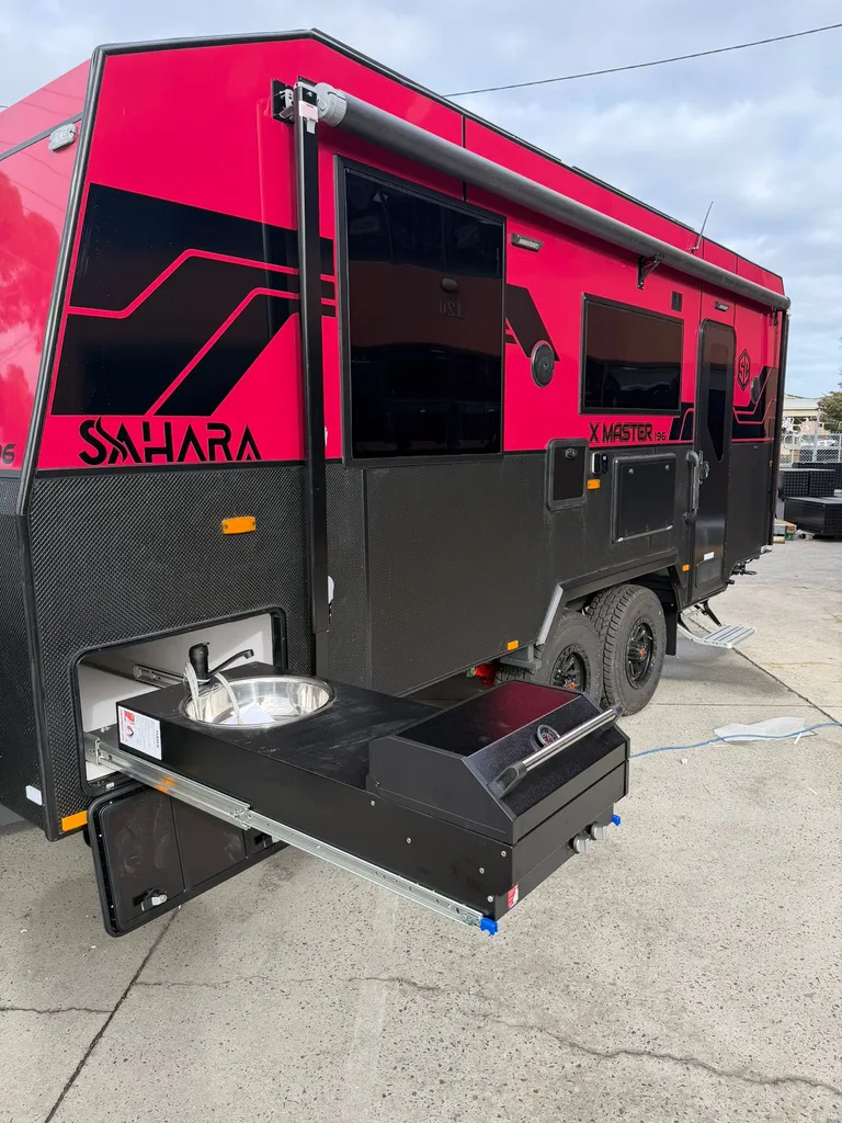 The slide-out kitchen on a red Sahara X-Master