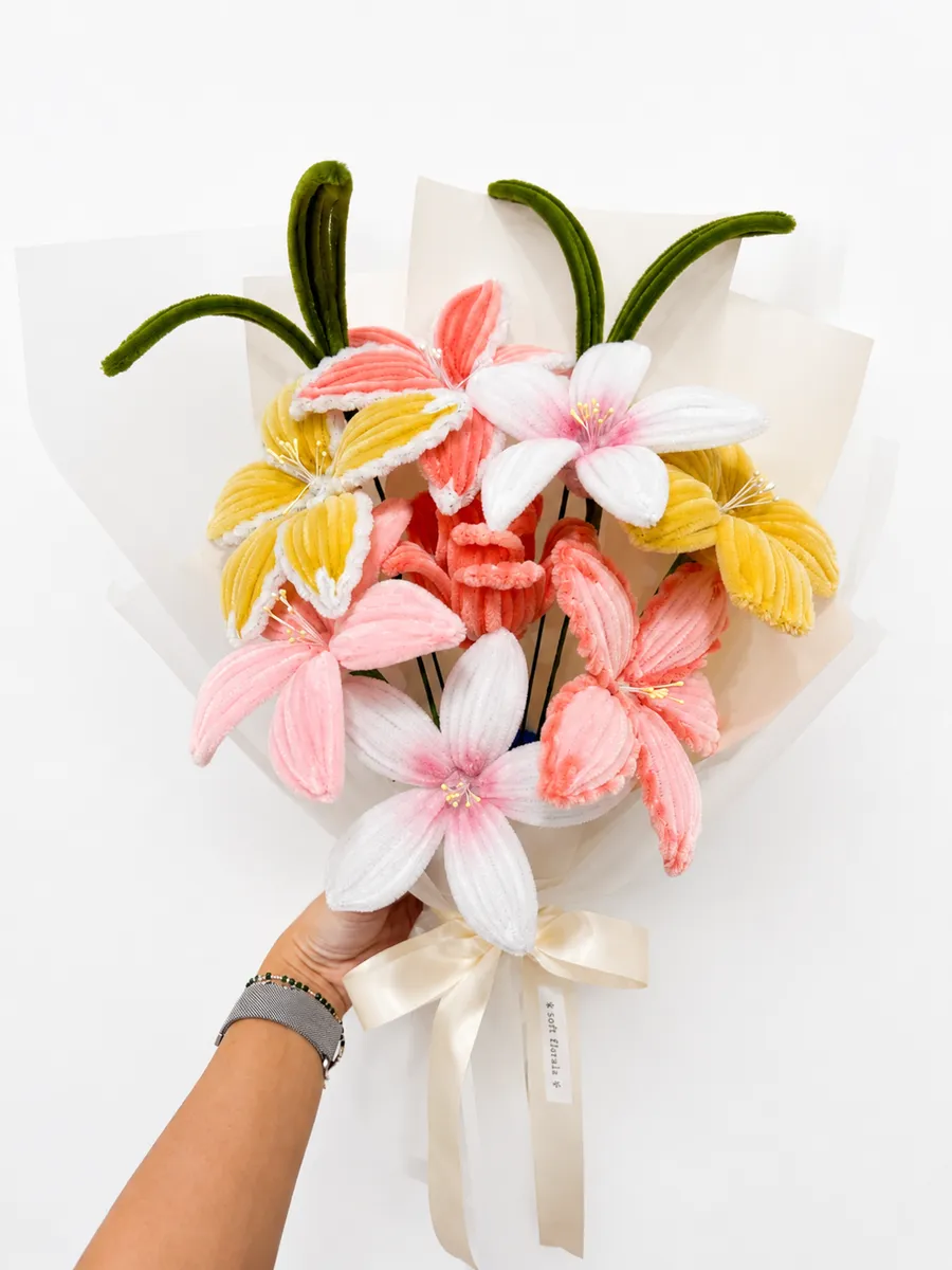 The Peach Sorbet bouquet held in hand